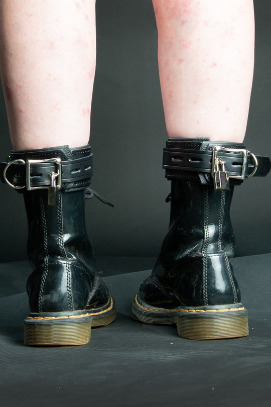 Leather submissive ankle cuffs